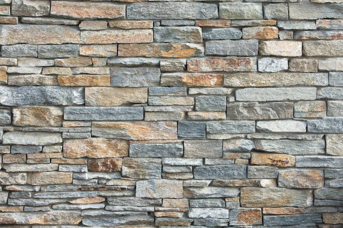 Stone Cladding in Kenya: Why Adhesive Alone Fails on Tall Walls